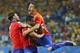 Chile's Jean Beausejour, center, celebrates with teammates after scoring his side's third goal during the group B World Cup soccer match between Chile and Australia in the Arena Pantanal in Cuiaba, Brazil, Friday, June 13, 2014. (AP Photo/Frank Augstein)