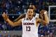 ARLINGTON, TX - APRIL 07: Shabazz Napier #13 of the Connecticut Huskies celebrates on the court after defeating the Kentucky Wildcats 60-54 in the NCAA Men's Final Four Championship at AT&T Stadium on April 7, 2014 in Arlington, Texas. (Photo by Ronald Martinez/Getty Images)