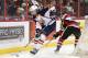 OTTAWA, ON - MARCH 13: Aaron Ekblad #5 of the Barrie Colts skates with the puck past Travis Konecny #17 of the Ottawa 67's during an OHL game at Canadian Tire Centre on March 13, 2014 in Ottawa, Ontario, Canada. (Photo by Jana Chytilova/Freestyle Photography/Getty Images)