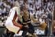 San Antonio Spurs guard Patty Mills (8) drives around Miami Heat forward Chris Andersen (11) in the second half in Game 3 of the NBA basketball finals, Tuesday, June 10, 2014, in Miami. (AP Photo/Wilfredo Lee)