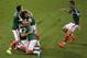 Mexico's players celebrate after Mexico's Oribe Peralta scored during the group A World Cup soccer match between Mexico and Cameroon in the Arena das Dunas in Natal, Brazil, Friday, June 13, 2014. (AP Photo/Hassan Ammar)