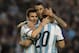 Argentina's Lionel Messi, left, celebrates with Argentina's Angel Di Maria, center, and Argentina's Sergio Aguero after scoring against Slovenia during their international friendly soccer match in La Plata, Argentina, Saturday, June 7, 2014. Argentina's team is leaving June 9 for Brazil to compete in the World Cup. (AP Photo/Eduardo Di Baia)