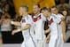 Germany's Miroslav Klose, second right, celebrates his side's fourth goal with team mates Lukas Podolski, right, Benedikt Hoewedes and Bastian Schweinsteiger, left, during a soccer friendly match between Germany and Armenia in the Coface Arena in Mainz, Germany, Friday, June 6, 2014. (AP Photo/Michael Probst)