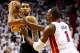 MIAMI, FL - JUNE 12: Tim Duncan #21 of the San Antonio Spurs looks to pass as Chris Bosh #1 of the Miami Heat defends during Game Four of the 2014 NBA Finals at American Airlines Arena on June 12, 2014 in Miami, Florida. NOTE TO USER: User expressly acknowledges and agrees that, by downloading and or using this photograph, User is consenting to the terms and conditions of the Getty Images License Agreement. (Photo by Andy Lyons/Getty Images)