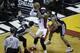 San Antonio Spurs guard Danny Green (4) and forward Kawhi Leonard (2) apply pressure on Miami Heat forward LeBron James (6) in the first half in Game 4 of the NBA basketball finals, Thursday, June 12, 2014, in Miami. (AP Photo/Wilfredo Lee)