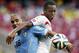 Uruguay's Maxi Pereira (16) struggles with Costa Rica's Junior Diaz during the group D World Cup soccer match between Uruguay and Costa Rica at the Arena Castelao in Fortaleza, Brazil, Saturday, June 14, 2014. (AP Photo/Fernando Llano)