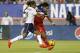 TAMPA, FL - JUNE 14: Forward Sydney Leroux #2 of the United States takes a shot against defender Laura Georges #4 of France to score a goal during the first half of a women's friendly soccer match on June 14, 2014 at Raymond James Stadium in Tampa, Florida. (Photo by Brian Blanco/Getty Images)