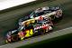 KANSAS CITY, KS - MAY 10: Jeff Gordon, driver of the #24 Axalta Coatings Chevrolet, races Kevin Harvick, driver of the #4 Jimmy John's Chevrolet, during the NASCAR Sprint Cup Series 5-Hour Energy 400 at Kansas Speedway on May 10, 2014 in Kansas City, Kansas. (Photo by Kyle Rivas/Getty Images)
