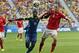 Ecuador's Enner Valencia pushes off Switzerland's Steve von Bergen as they try to reach the ball during the group E World Cup soccer match between Switzerland and Ecuador at the Estadio Nacional in Brasilia, Brazil, Sunday, June 15, 2014. (AP Photo/Marcio Jose Sanchez)