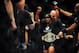 Jun 14, 2014; Vancouver, British Columbia, Canada; Demetrious Johnson (red) reacts after defeating Ali Bagautinov (blue) in the flyweight title bout at UFC 174 at Rogers Arena. Mandatory Credit: Anne-Marie Sorvin-USA TODAY Sports