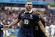 France's Karim Benzema celebrates with teammate France's Patrice Evra after scoring his side's first goal on a penalty kick during the group E World Cup soccer match between France and Honduras at the Estadio Beira-Rio in Porto Alegre, Brazil, Sunday, June 15, 2014. (AP Photo/Fernando Vergara)