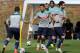 Portugal's Cristiano Ronaldo, center, runs with the ball during a training session with his teammates in Campinas, Brazil, Saturday, June 14, 2014. Portugal plays in group G of the Brazil 2014 soccer World Cup. (AP Photo/Paulo Duarte)