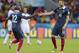 France's Karim Benzema, right, celebrates with France's Rio Mavuba after scoring his side's third goal during the group E World Cup soccer match between France and Honduras at the Estadio Beira-Rio in Porto Alegre, Brazil, Sunday, June 15, 2014. (AP Photo/David Vincent)