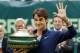 Switzerland's Roger Federer holds the trophy and waves after winning the final of the Gerry Weber Open tennis tournament in Halle, Germany, Sunday, June 15, 2014. Federer beat Colombia's Alejandro Falla 7-6 and 7-6. (AP Photo/Michael Probst)