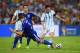RIO DE JANEIRO, BRAZIL - JUNE 15: Lionel Messi of Argentina controls the ball on his way to scoring his team's second goal against Ermin Bicakcic (L) and Muhamed Besic of Bosnia and Herzegovina during the 2014 FIFA World Cup Brazil Group F match between Argentina and Bosnia-Herzegovina at Maracana on June 15, 2014 in Rio de Janeiro, Brazil. (Photo by Matthias Hangst/Getty Images)