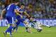 Argentina's Lionel Messi falls to the pitch after being fouled during the group F World Cup soccer match between Argentina and Bosnia at the Maracana Stadium in Rio de Janeiro, Brazil, Sunday, June 15, 2014. (AP Photo/Victor R. Caivano)