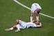SALVADOR, BRAZIL - JUNE 16: Andre Schuerrle of Germany stands over injured teammate Mats Hummels during the 2014 FIFA World Cup Brazil Group G match between Germany and Portugal at Arena Fonte Nova on June 16, 2014 in Salvador, Brazil. (Photo by Matthew Lewis/Getty Images)