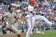 Texas' Ben Johnson, left, can't beat the throw from Louisville shortstop Sutton Whiting to first baseman Grant Kay, right, and is out at first base in the fifth inning of an NCAA baseball College World Series elimination game in Omaha, Neb., Monday, June 16, 2014. (AP Photo/Ted Kirk)