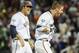 Virginia's Mike Papi, right, and teammate Austin Young, celebrate after Papi hit a double in the ninth inning against Missisippi that scored Thomas Woodruff to win an NCAA baseball College World Series game in Omaha, Neb., Sunday, June 15, 2014. Virginia won 2-1. (AP Photo/Eric Francis)