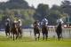 YORK, ENGLAND - AUGUST 21: Joseph O'Brien riding Declaration Of War (C, dark blue) wins The Juddmonte International Stakes from Trading Leather (R) as Richard HUghes riding Toronado (L) finish tailed off at York racecourse on August 21, 2013 in York, England. (Photo by Alan Crowhurst/Getty Images)