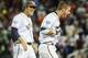 Virginia's Mike Papi, right, and teammate Austin Young, celebrate after Papi hit a double in the ninth inning against Missisippi that scored Thomas Woodruff to win an NCAA baseball College World Series game in Omaha, Neb., Sunday, June 15, 2014. Virginia won 2-1. (AP Photo/Eric Francis)