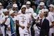 Most Valuable Player San Antonio Spurs forward Kawhi Leonard, center celebrates with the team after Game 5 of the NBA basketball finals against the Miami Heat on Sunday, June 15, 2014, in San Antonio. The Spurs won the NBA championship 104-87. (AP Photo/Tony Gutierrez)