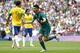 Mexico's Oribe Peralta, right, celebrates in front of Brazil's Leandro Damiao, left, during the men's soccer final at the 2012 Summer Olympics, Saturday, Aug. 11, 2012, in London. (AP Photo/Jon Super)