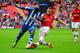 LONDON, ENGLAND - APRIL 12: Marc-Antoine Fortune of Wigan Athletic is tackled by Thomas Vermaelen of Arsenal during the FA Cup Semi-Final match between Wigan Athletic and Arsenal at Wembley Stadium on April 12, 2014 in London, England. (Photo by Mike Hewitt/Getty Images)