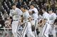 Vanderbilt players from left: Kyle Smith (39), closing pitcher Walker Buehler (13), Carson Fulmer (15), Nolan Rogers (18) and Will Cooper (23) celebrate their 6-4 win over UC Irvine in an NCAA baseball College World Series game in Omaha, Neb., Monday, June 16, 2014. (AP Photo/Eric Francis)