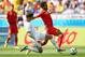 BELO HORIZONTE, BRAZIL - JUNE 17: Carl Medjani of Algeria tackles Moussa Dembele of Belgium during the 2014 FIFA World Cup Brazil Group H match between Belgium and Algeria at Estadio Mineirao on June 17, 2014 in Belo Horizonte, Brazil. (Photo by Ian Walton/Getty Images)