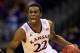 KANSAS CITY, MO - MARCH 13: Andrew Wiggins #22 of the Kansas Jayhawks drives upcourt as Marcus Smart #33 of the Oklahoma State Cowboys defends during the Big 12 Basketball Tournament quarterfinal game at Sprint Center on March 13, 2014 in Kansas City, Missouri. (Photo by Jamie Squire/Getty Images)