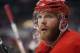 Detroit Red Wings right wing Dan Cleary watches from the bench while playing the Pittsburgh Penguins in Game 1 of the NHL Stanley Cup finals hockey series in Detroit, Saturday, May 30, 2009. (AP Photo/Carlos Osorio)