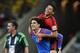 Mexico's goalkeeper Guillermo Ochoa (13) carries his teammate Mexico's Javier Aquino after their 0-0 tie with Brazil during the group A World Cup soccer match between Brazil and Mexico at the Arena Castelao in Fortaleza, Brazil, Tuesday, June 17, 2014. (AP Photo/Marcio Jose Sanchez)