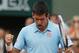 Serbia's Novak Djokovic reacts after a winning point as he plays Spain's Rafael Nadal during their final match of the French Open tennis tournament at the Roland Garros stadium, in Paris, France, Sunday, June 8, 2014. (AP Photo/Michel Euler)