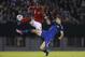 Trinidad and Tobago's Sheldon Bateau, left, and Argentina's Federico Fernandez, right, vie for the ball during their international friendly soccer match in Buenos Aires, Argentina, Wednesday, June 4, 2014. (AP Photo/Victor R. Caivano)