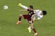 Russia's Viktor Fayzulin, left, and South Korea's Han Kook-young, right, challenge for the ball during their group H World Cup soccer match at the Arena Pantanal in Cuiaba, Brazil, Tuesday, June 17, 2014. (AP Photo/Thanassis Stavrakis)