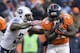 Tennessee Titans strong safety Bernard Pollard, left, tackles Denver Broncos running back Montee Ball during the second half of an NFL football game on Sunday, Dec. 8, 2013, in Denver. (AP Photo/Jack Dempsey)