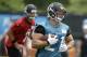 Jacksonville Jaguars running back Toby Gerhart, right, runs with the ball after a handoff from quarterback Chad Henne, left, during an NFL organized team activities football practice in in Jacksonville, Fla., Monday, June 2, 2014. (AP Photo/John Raoux)