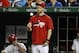 Washington Nationals left fielder Bryce Harper, center, tosses a ball as he stands in the dugout during a baseball game against the New York Mets at Nationals Park Friday, May 16, 2014, in Washington. (AP Photo/Alex Brandon)