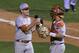 Texas pitcher Chad Hollingsworth, left, and catcher Tres Barrera, right, celebrate after defeating Texas Tech in the first-round game against of the Big 12 conference NCAA college baseball tournament in Oklahoma City, Wednesday, May 21, 2014. Texas won 8-3. (AP Photo/Alonzo Adams)