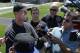 San Francisco 49ers head coach Jim Harbaugh, left, speaks to reporters during NFL football minicamp in Santa Clara, Calif., Tuesday, June 17, 2014. (AP Photo/Jeff Chiu)