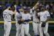 DETROIT, MI - JUNE 17: Eric Hosmer #35 of the Kansas City Royals celebrates with teammates Omar Infante #14, Jarrod Dyson #1, Alcides Escobar #2 and Lorenzo Cain #6 after defeating the Detroit Tigers 11-4 and taking first place in the AL Central at Comerica Park on June 17, 2014 in Detroit, Michigan. (Photo by Duane Burleson/Getty Images)