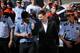 Barcelona F.C. soccer player Lionel Messi, centre right, gestures, as he arrives at a court to answer questions in a tax fraud case, in Gava, near Barcelona, Spain, Friday, Sept. 27, 2013. Barcelona star Lionel Messi and his father are appearing before a Spanish judge to answer questions in a tax fraud case. A complaint lodged by a Spanish state prosecutor in June said Messi and his father tried to conceal earnings from the player's image rights. The complaint alleged the Argentina international owed 4 million euros ($5.3 million) in back taxes from 2007, 2008 and 2009. (AP Photo/Emilio Morenatti)