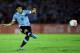 MONTEVIDEO, URUGUAY - NOVEMBER 20: Luis Suarez of Uruguay runs with the ball during leg 2 of the FIFA World Cup Qualifier match between Uruguay and Jordan at Centenario Stadium Stadium on November 20, 2013 in Montevideo, Uruguay. (Photo by Friedemann Vogel/Getty Images)