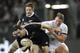 New Zealand’s Ben Smith, front, tackled by England’s Dylan Hartley in the second international rugby test match at Forsyth Barr Stadium in Dunedin, New Zealand, Saturday, June 14, 2014. (AP Photo/SNPA, Ross Setford) NEW ZEALAND OUT