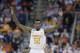 Tennessee guard Jordan McRae (52) celebrates near the end of the second half of an NCAA college basketball third-round tournament game against Mercer, Sunday, March 23, 2014, in Raleigh. Tennessee Won 83-63. (AP Photo/Gerry Broome)