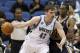 Minnesota Timberwolves forward Kevin Love (42) drives against Utah Jazz forward Jeremy Evans, right, during the first quarter of an NBA basketball game in Minneapolis, Wednesday, April 16, 2014. (AP Photo/Ann Heisenfelt)
