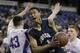 St. John Bosco guard Tyler Dorsey, center, eludes Folsom center Colin Russell on a drive to the basket during the third quarter of the boys' Division 2 CIF basketball championship game Saturday, March 29, 2014, in Sacramento, Calif. St. John Bosco won 63-54. (AP Photo/Rich Pedroncelli)