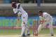 West Indies debutante batsman Jermaine Blackwood, left, bats on his way to score a half century as New Zealand's wicket keeper BJ Watling, right, look on during the third day on their second cricket Test match in Port of Spain, Trinidad, Wednesday, June 18, 2014. (AP Photo/Arnulfo Franco)