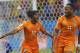 Ivory Coast's Gervinho (10) celebrates with teammate Didier Drogba (11) after Gervinho scored his side's second goal during the group C World Cup soccer match between Ivory Coast and Japan at the Arena Pernambuco in Recife, Brazil, Saturday, June 14, 2014. (AP Photo/Petr David Josek)